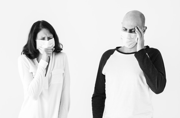 Sick couple wearing surgical mask (Demo)